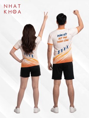 Alternative view of Đồng Phục Team Building Trắng Phối Viền Cam Họa Tiết Sọc Chéo
